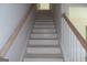 New staircase with wooden railings and white trim at 49 Durham Estates Dr, Sharpsburg, GA 30277