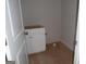 Walk-in closet with white cabinets and wood floor offering storage solutions and organizational space in the residence at 49 Durham Estates Dr, Sharpsburg, GA 30277