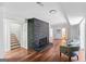 Spacious basement with brick fireplace, hardwood flooring, and access to stairs and other rooms at 2541 Peyton Woods Sw Trl, Atlanta, GA 30311