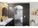 Stylish bathroom boasts double sink vanity, decorative lighting, and tub/shower combo at 2541 Peyton Woods Sw Trl, Atlanta, GA 30311