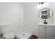 Simple bathroom with a walk-in shower, sink, and toilet, all well-lit and efficient at 2541 Peyton Woods Sw Trl, Atlanta, GA 30311