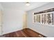Bright, airy bedroom with hardwood floors and natural light through large windows at 2541 Peyton Woods Sw Trl, Atlanta, GA 30311