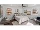 Light-filled bedroom with natural light, gray accents, wood flooring, and modern decor at 2541 Peyton Woods Sw Trl, Atlanta, GA 30311