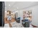 This open-concept living room showcases modern decor with a kitchen view and deck access at 2541 Peyton Woods Sw Trl, Atlanta, GA 30311