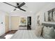 The main bedroom features neutral paint, modern ceiling fan, and en suite bath at 2541 Peyton Woods Sw Trl, Atlanta, GA 30311