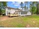 Spacious backyard with a wooden deck perfect for outdoor entertaining and relaxation at 101 Jasmine Path, Peachtree City, GA 30269