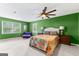 Expansive bedroom with plush carpet, abundant natural light, and a decorative ceiling fan at 101 Jasmine Path, Peachtree City, GA 30269