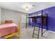 Bedroom featuring a bunk bed, window, and gray carpet at 101 Jasmine Path, Peachtree City, GA 30269