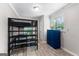 Comfortable bedroom with a bunk bed, bright blue dresser, and ample natural light at 101 Jasmine Path, Peachtree City, GA 30269