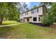 Charming two-story home boasts a manicured lawn, complementing its inviting facade and classic design at 101 Jasmine Path, Peachtree City, GA 30269