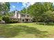 Inviting two-story home with a well-maintained lawn, set amidst lush trees for added privacy at 101 Jasmine Path, Peachtree City, GA 30269
