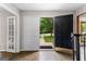 The home's foyer with its open door, welcomes guests into its naturally lit interior at 101 Jasmine Path, Peachtree City, GA 30269