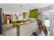 Bright kitchen with stainless steel appliances, granite countertops, and an open view into dining room at 101 Jasmine Path, Peachtree City, GA 30269