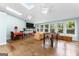 Spacious sunroom with tile floors, skylights, large windows and seating area at 101 Jasmine Path, Peachtree City, GA 30269