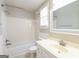 Bathroom with shower and tub combination, window with blinds, toilet, and vanity sink at 1416 Emerald Pine Ct, Lawrenceville, GA 30043