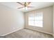 Bedroom with neutral paint, carpet, ceiling fan, and double window with blinds at 1416 Emerald Pine Ct, Lawrenceville, GA 30043