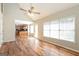 Bright and airy living room showcasing hardwood floors and an open concept to the kitchen at 1416 Emerald Pine Ct, Lawrenceville, GA 30043