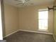 Well-lit bedroom boasts neutral carpeting, fresh paint, and natural light at 5799 Eagles Feather Ln, Riverdale, GA 30274