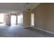 Open living room with neutral walls and carpet offers a versatile living space at 5799 Eagles Feather Ln, Riverdale, GA 30274