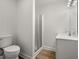 Bathroom featuring a toilet, shower and a vanity at 1260 Heards Ferry Rd, Sandy Springs, GA 30328