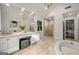 Bright bathroom featuring a soaking tub, double vanity, and glass enclosed shower at 1260 Heards Ferry Rd, Sandy Springs, GA 30328