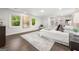 Sun-filled bedroom features windows with backyard view, built-in bookshelves, and stylish decor at 1260 Heards Ferry Rd, Sandy Springs, GA 30328
