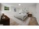 Bedroom featuring a large bed, windows and wooden floors at 1260 Heards Ferry Rd, Sandy Springs, GA 30328