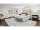 Bright bedroom boasting a luxurious bed, built-in bookcases, and a cozy sitting area at 1260 Heards Ferry Rd, Sandy Springs, GA 30328