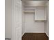 White closet design with shelving and gold rods maximizing space and storage at 1260 Heards Ferry Rd, Sandy Springs, GA 30328