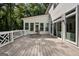 Spacious deck featuring stylish railing, perfect for outdoor relaxation and entertaining with lush green surroundings at 1260 Heards Ferry Rd, Sandy Springs, GA 30328