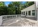 Spacious deck featuring stylish railing, perfect for outdoor relaxation and entertaining with lush green surroundings at 1260 Heards Ferry Rd, Sandy Springs, GA 30328