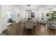 Bright dining room featuring hardwood floors, large windows, and neutral paint at 1260 Heards Ferry Rd, Sandy Springs, GA 30328