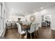 Bright dining area shows modern table with six chairs, leading to a living room and open to a spacious kitchen at 1260 Heards Ferry Rd, Sandy Springs, GA 30328