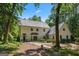 Beautiful home featuring mature landscaping and a stone walkway at 1260 Heards Ferry Rd, Sandy Springs, GA 30328
