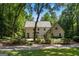 Charming home featuring classic architectural design with a lush, mature landscape at 1260 Heards Ferry Rd, Sandy Springs, GA 30328