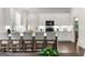 Updated kitchen with white cabinets, stainless appliances, quartz counters and bar seating, perfect for entertaining at 1260 Heards Ferry Rd, Sandy Springs, GA 30328