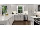 Updated kitchen with white cabinets and quartz counters features modern stainless steel appliances at 1260 Heards Ferry Rd, Sandy Springs, GA 30328