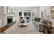 Living room with fireplace, elegant seating and oversized windows for natural light at 1260 Heards Ferry Rd, Sandy Springs, GA 30328