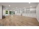 Spacious living room featuring hardwood floors, built-in shelving, and natural light at 1260 Heards Ferry Rd, Sandy Springs, GA 30328