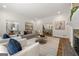 Spacious living room with fireplace, hardwood floors, and views into the dining room at 1260 Heards Ferry Rd, Sandy Springs, GA 30328