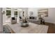 Bright living room features a fireplace, French doors to the porch, and hardwood floors at 1260 Heards Ferry Rd, Sandy Springs, GA 30328