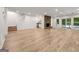 Spacious living room with wood floors and stone fireplace at 1260 Heards Ferry Rd, Sandy Springs, GA 30328