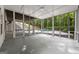 A bright screened-in porch, with view of pool and wooded backyard at 1260 Heards Ferry Rd, Sandy Springs, GA 30328