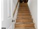 Staircase featuring wood treads and a white handrail at 1260 Heards Ferry Rd, Sandy Springs, GA 30328