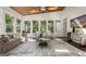 Bright sunroom with wood ceiling, multiple windows offering natural light, and outdoor views at 1260 Heards Ferry Rd, Sandy Springs, GA 30328