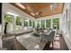 Bright sunroom with wood ceiling, multiple windows offering natural light, and outdoor views at 1260 Heards Ferry Rd, Sandy Springs, GA 30328