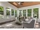 Bright sunroom with wood ceiling, multiple windows offering natural light, and outdoor views at 1260 Heards Ferry Rd, Sandy Springs, GA 30328