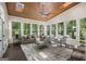 Bright sunroom with wood ceiling, multiple windows offering natural light, and outdoor views at 1260 Heards Ferry Rd, Sandy Springs, GA 30328