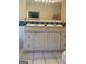 Bright bathroom with double sink vanity and tile backsplash, offering ample storage at 191 Lagrange St, Grantville, GA 30220