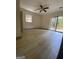 Inviting bedroom featuring a ceiling fan and a sliding door to a private balcony at 191 Lagrange St, Grantville, GA 30220